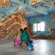 Image for article titled Japanese artists create stunning mud paintings on this Indian school’s walls—then wipe them off